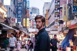 colorful market street in korea man standing in alley way in korea korean market street